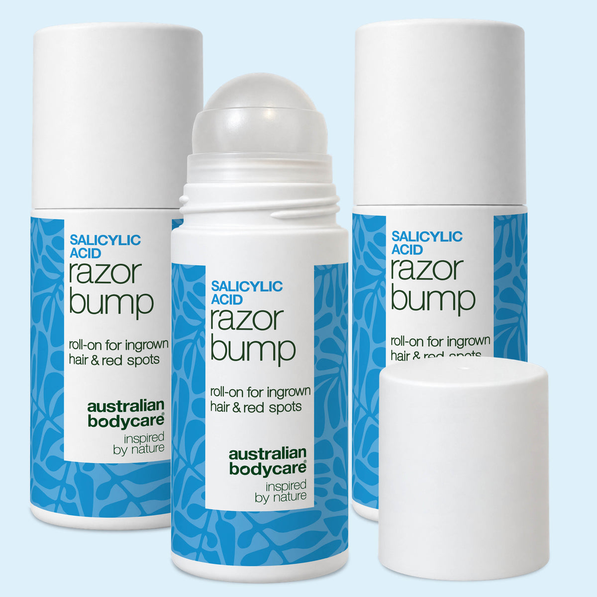 Tres roll-ons Salicylic Acid Razor Bump de Australian Bodycare sobre fondo blanco, el delantero con el tapón al lado. Pack de 3.